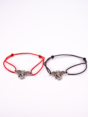 two pair bracelets are made of Korean rope and there is a love emblem that can be fused because there are magnets in it.