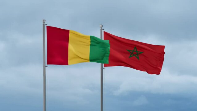 Morocco flag and Republic of Guinea flag waving together on cloudy sky, endless seamless loop, two country relations concept