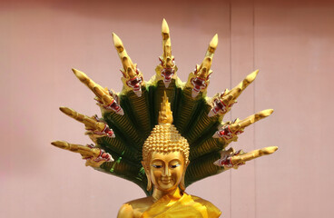 large golden buddha at the temple in the city Udon Thani Province, Thailand, is revered by the Buddhists.