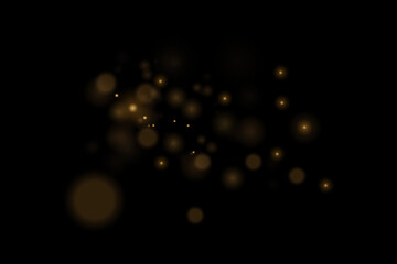 Light abstract glowing bokeh lights. Bokeh light effect on a black background. Festive golden glowing background.