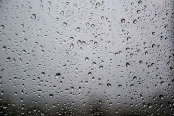 Raindrops on window glass background abstract background. 