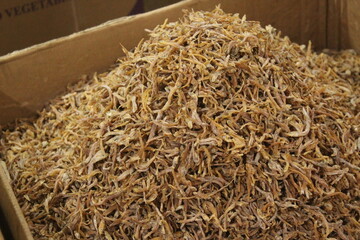 pile of dried fishes on a cardboard box