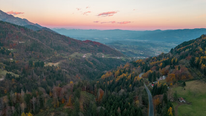 Aerial panorama of Pedavena forest.
Dolomites in the distance, autumn foliage