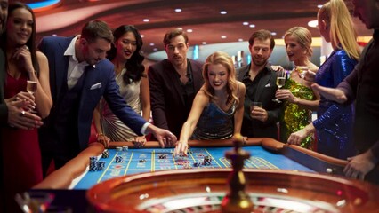 Gathering of Wealthy Young Individuals, Standing Together Around a Roulette Table in a Contemporary Casino Setting. Cinematic Nightlife Footage, Carefree Gamblers Congratulating the Winning Players - Powered by Adobe