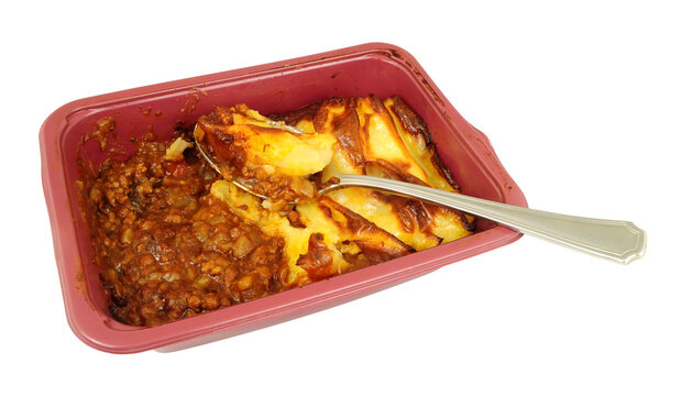 Cheap cottage pie convenience ready meal with minced beef and topped with mashed potato in a plastic tray