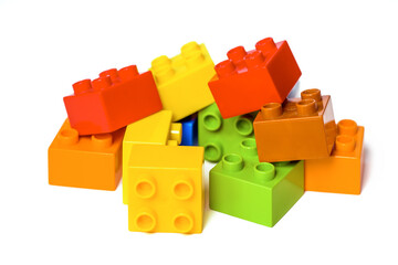 Fototapeta premium Pile of Colorful Construction Blocks on white. Educational toy for children.