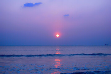 Tropical sea beach in summer time Purple sky on sunny day. Golden sand beach sea peaceful scenery on the beach. Travel vacation seaside outdoor. Ocean island beautiful dramatic Magenta landscape