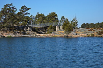 Suspension bridge on hiking track on Stora Krokholmen in Stendörrens Naturreservat in Sweden, Europe
