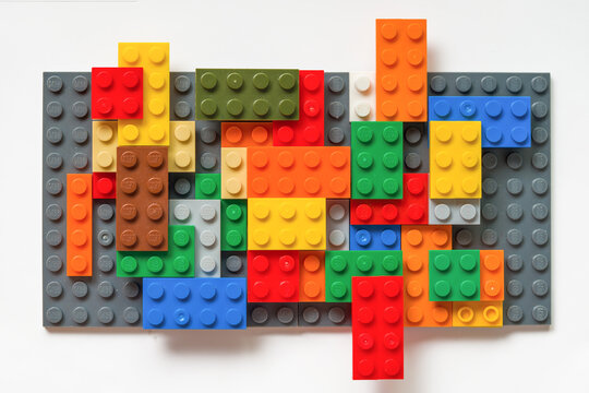 Multicolored Toy Bricks Design: Diverse Construction Elements on white. Idea, creative concept. Lego blocks. Novosibirsk, Russia - October 26, 2023.