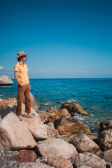 a man enjoying the journey, blending style with the ocean's embrace