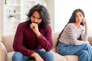 Young indian woman looking at her angry husband