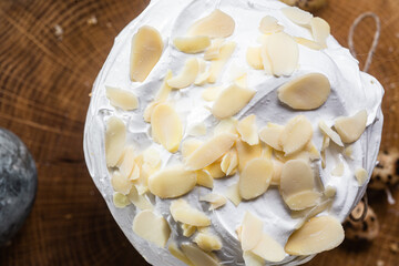 panettone. Easter cake with meringue and decoration on the table