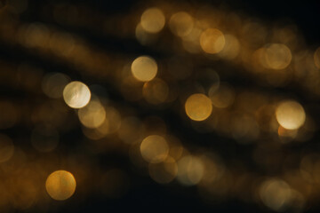Abstract background of blurred yellow lights for design. Lights bokeh dis focus. Christmas...