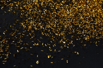 Abstract background of blurred yellow lights for design. Lights bokeh dis focus. Golden sequins on...