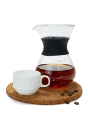 Coffee in a small glass jug and cup on tray isolated white background..
