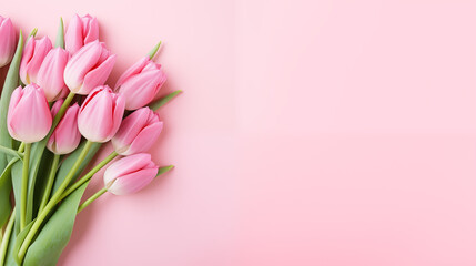 Pink tulips on pastel pink background, flatlay with copy space. Spring banner. International women's day, March 8, birthday, anniversary greeting card template
