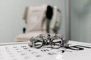 Image of test glasses with letter diagram for eye examination, vision optometry background. Vision...
