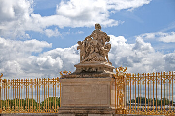 The golden doors and white marble statues of Versailles castle in the city of Paris - PARIS, FRANCE...