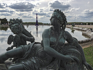 Fototapeta na wymiar The bronze statues in the garden of Versailles castle in the city of Paris.