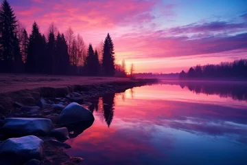 Abwaschbare Fototapete Candy Pink magical transition from day to night along river landscape during twilight. Showcase the deepening colors of the sky and the subtle reflections on the water's surface