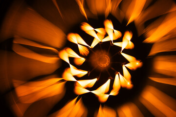 Abstract background with a tungsten lamp spiral glowing in the dark
