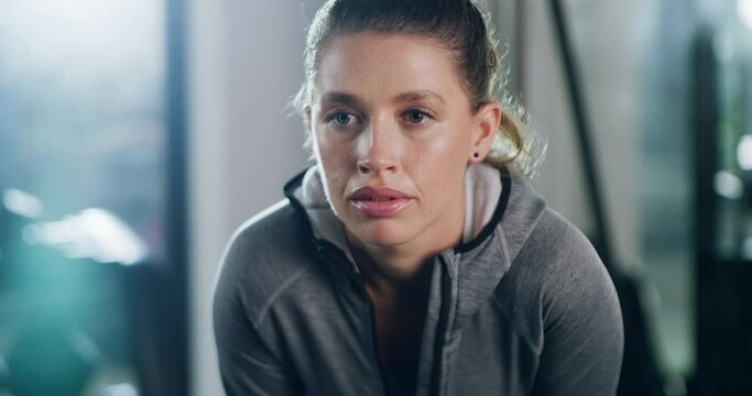 Break, gym and face of tired fitness woman breathing after training, exercise or intense cardio. Sports, fatigue or female athlete stop to breathe during workout, performance or weight loss challenge