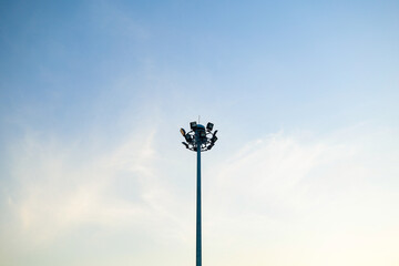 Stadium lighting poles for illumination at night.