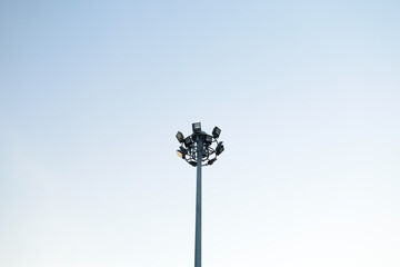 Stadium lighting poles for illumination at night.