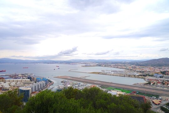 view over Gibraltar the port and runway of the International Gibraltar Airport Bay of Gibraltar, La L&iacute;nea de la Concepci&oacute;n, Rock of Gibraltar, Puente Mayorga, Algeciras, British, Andalusia, Spain