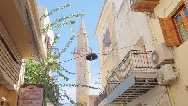 Crete streets in a summer day, Greece. Mosque Minaret
