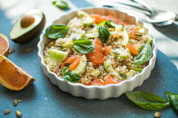 Rice salad with grapefruit, apple, avocado. Top view. Homemade Mexican Baja Rice Bowl with Avocado and Salsa