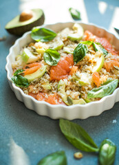 Homemade Mexican Baja Rice Bowl with Avocado and Salsa .Rice salad with grapefruit, apple, avocado. Top view
