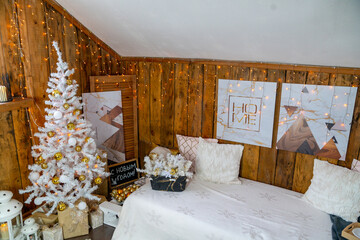 Christmas interior of the living room. The attic room of the house.