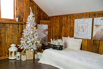 Christmas interior of the living room. The attic room of the house.