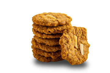 Side view stack of delicious homemade crispy coconut cookies isolated on white background with clipping path.