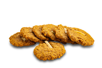 High angle view pile of delicious homemade crispy coconut cookies isolated on white background with clipping path.