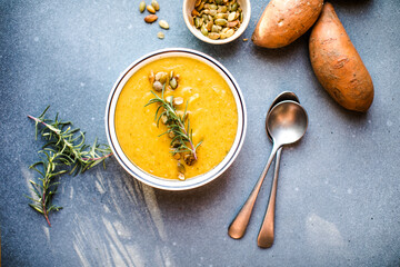 Sweet Potato Soup, Tasty Homemade Pumpkin, Sweet Potato, Carrot Soup in a Bowl on Bright Background