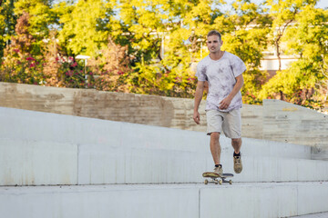 Fototapeta premium Man riding skateboard in skate park