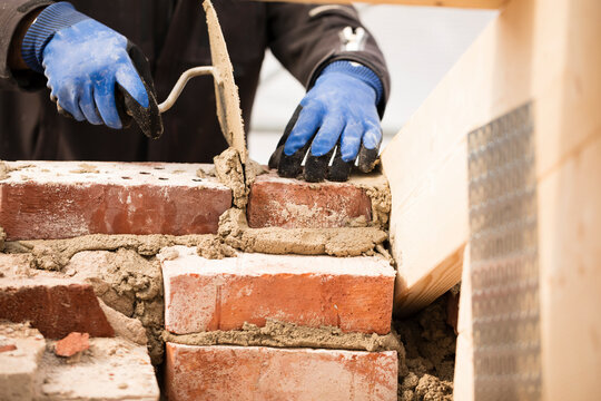 Bricklayer working on construction site