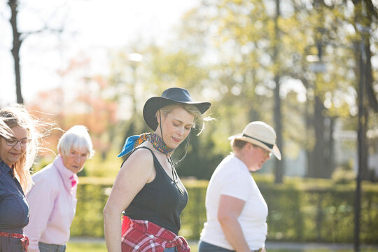 Women dancing together in park