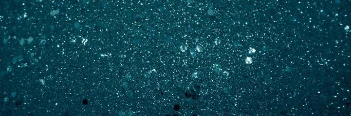 textured canvas of teal, with countless specks of white that resemble a blizzard or a flurry of stars in a teal night sky. - obrazy, fototapety, plakaty