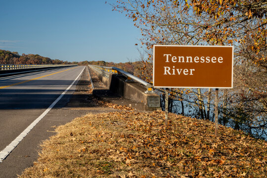 Tennessee River road sign at Natchez Trace Parkway - crossing from Tennessee to Alabama in fall scenery