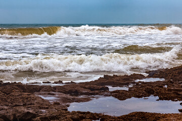 View of the volcanic shore of the Atlantic Ocean in the area of Essaouira in Morocco.