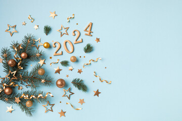 Christmas and New Year composition with 2024 golden numbers, fir tree branch, party confetti stars...