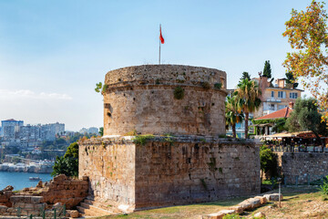 View of the Hıdırlık Tower in Antalya, Turkey. It is believed that the ruling Roman Empire built it in the second century CE. It has since been used as a fortification or a lighthouse. - obrazy, fototapety, plakaty