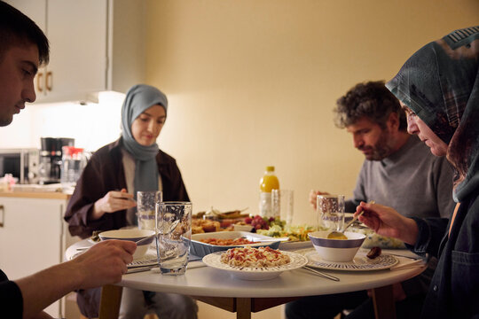 Family eating dinner together at home