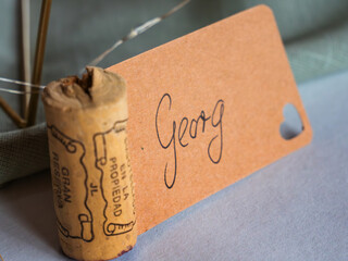 Creative name tag at an evening event made from old wine corks
