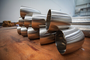 Stainless steel piping elbow component