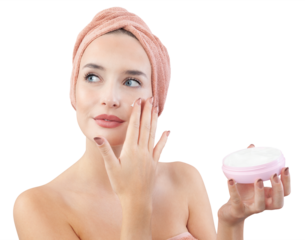 Cheerful young woman smiling, applying on face moisturizing skincare cream, lotion or mask for skin lifting and anti-aging, wears wrapped towel on head. On white background, beauty and spa concept