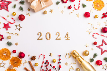 2024 christmas and New Year festive background from golden champagne bottle, gift or present box,...